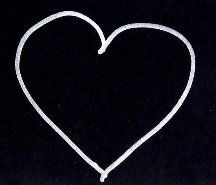 an outline of a heart in the dark with white ink