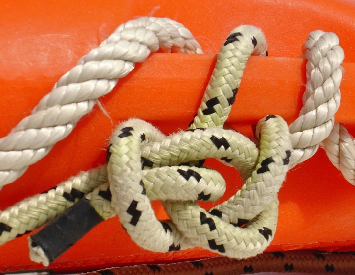 a roped up boat has two pieces of rope on it