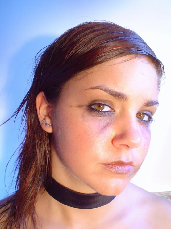 a woman with white eyes wearing a black choker
