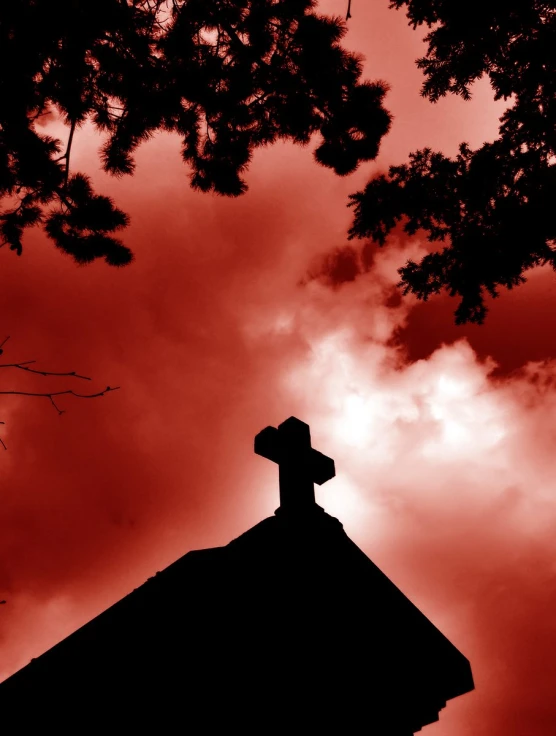 a red and black po of a tower with a cross on it