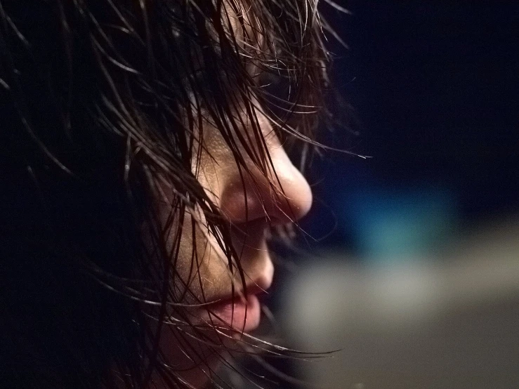 a woman with her back to the camera with her hair covered in frizzy hair