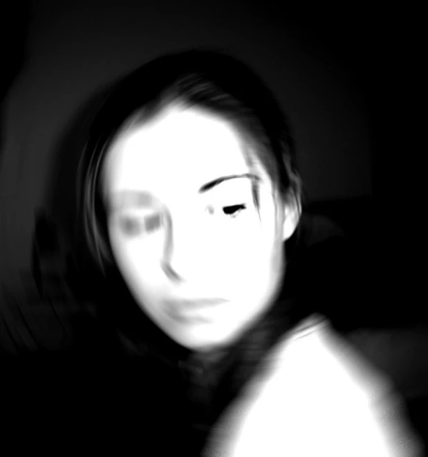 an image of a blurry woman on her cell phone