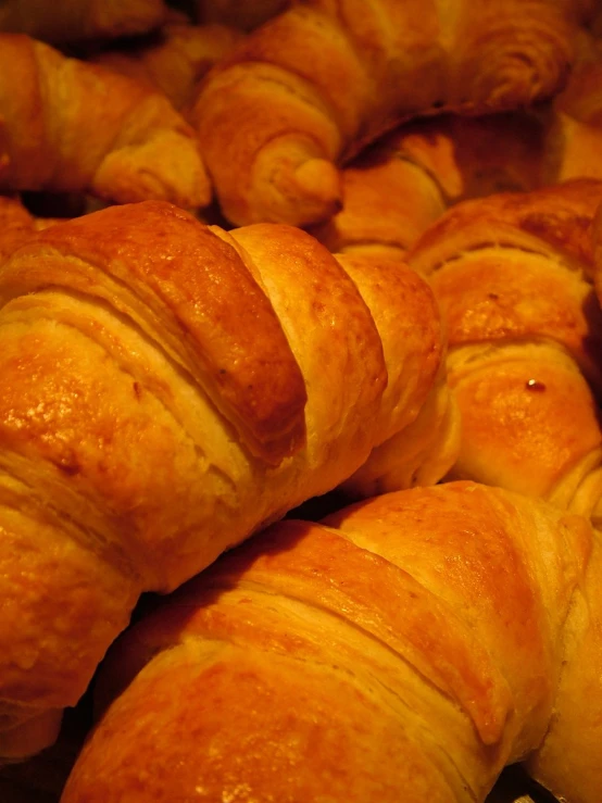 a pile of croissants that have been freshly made