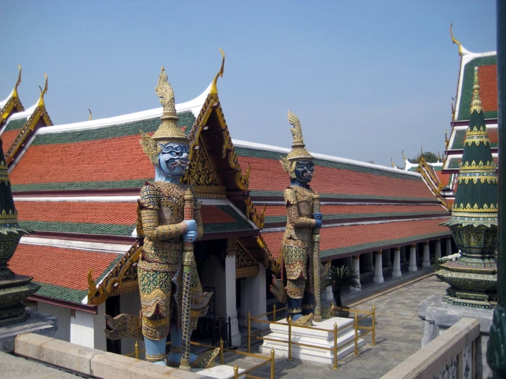 the roof has been made of gold and many colorful buddha statues