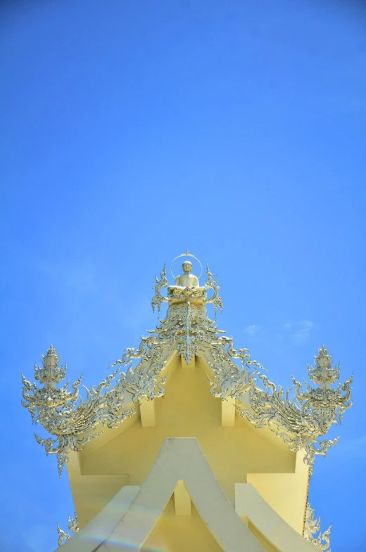 looking up at the tops of some ornate architecture