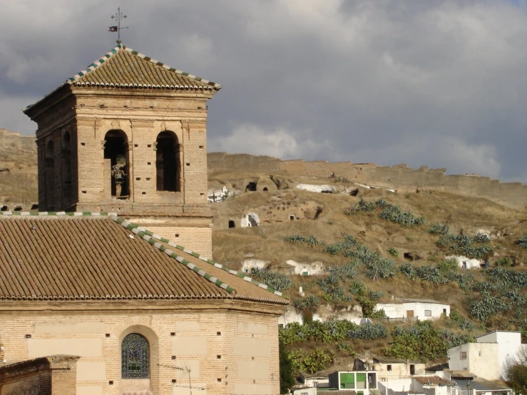 an old church with a clock in the center of it