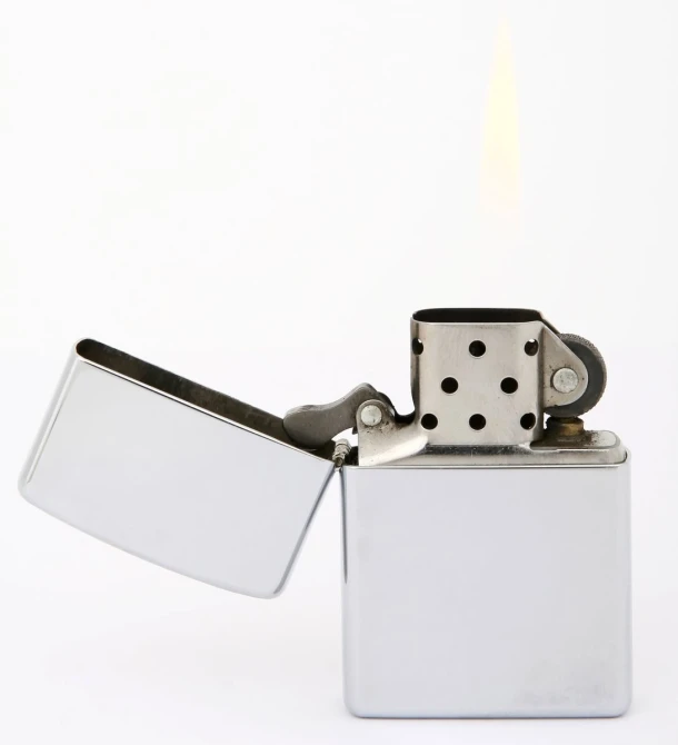 a zippo lighter sitting on top of a white surface