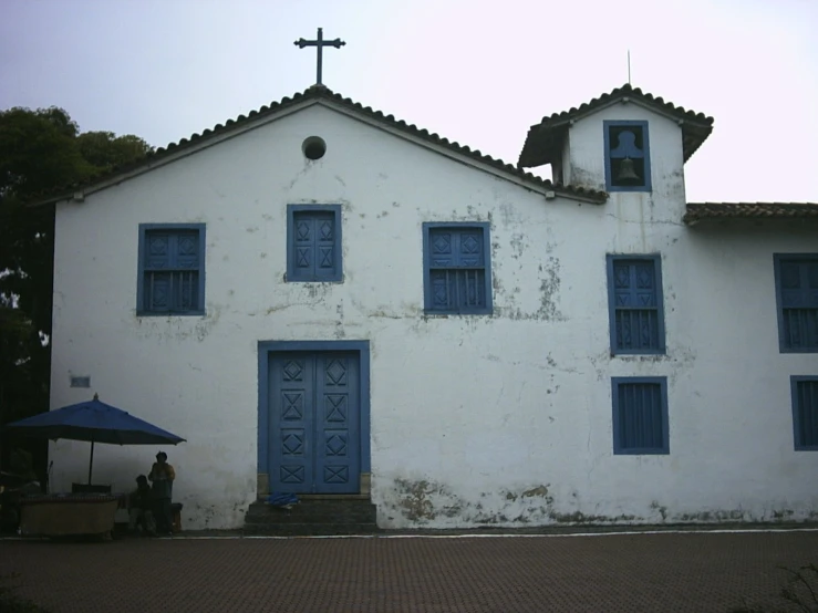 a church building has blue door and windows