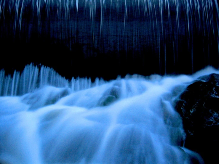 water that is flowing over some rocks