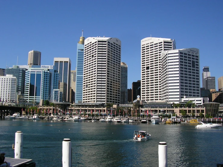 a large city with lots of tall buildings next to the water