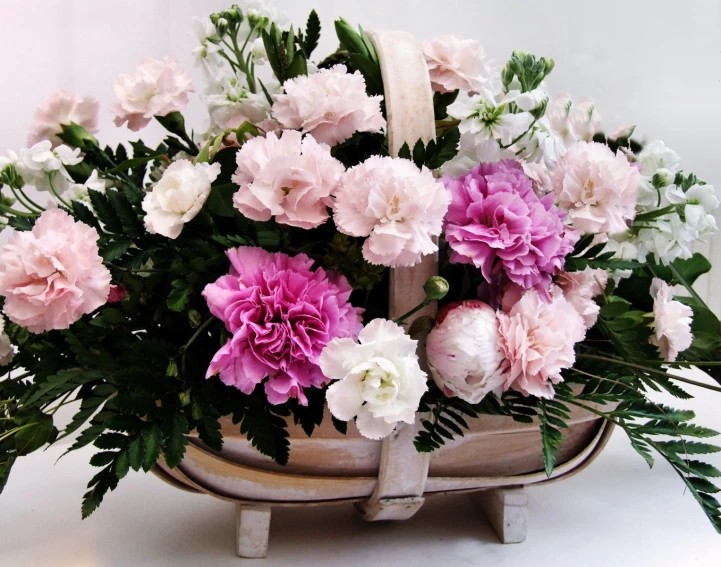 a bunch of pink flowers that are in a bowl