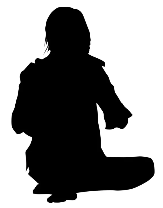 silhouette of a person sitting down holding an umbrella