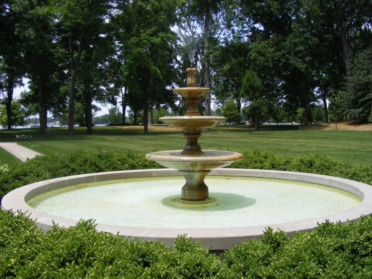 a fountain with a sculpture of a horse in the center