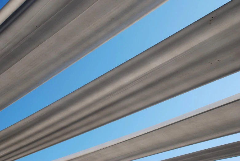 some metal beams against a blue sky