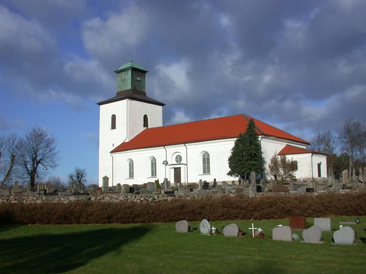 a large white building with a red roof