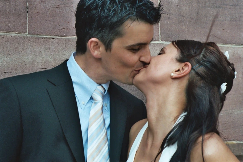 an image of a couple in love kissing