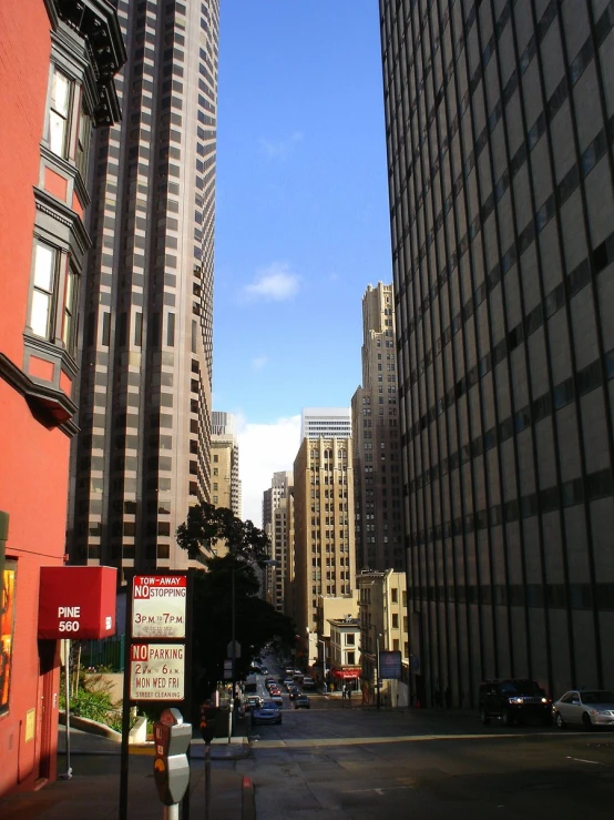 a street with tall buildings and signs near it