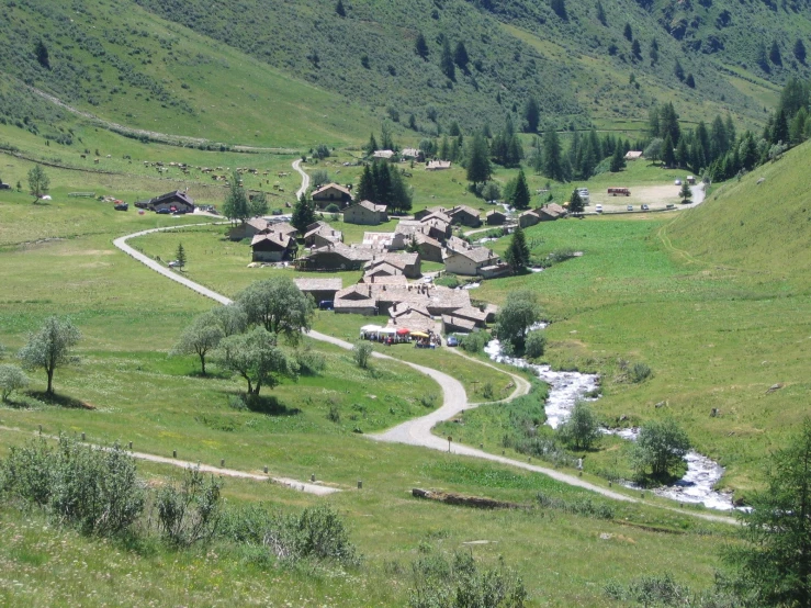 a mountain valley filled with lush green hillside