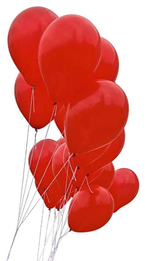 a bunch of red balloons are flying through the air