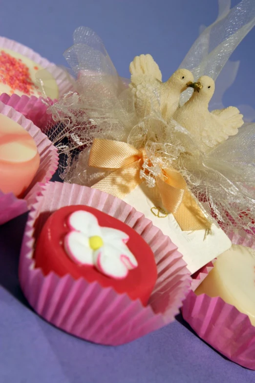 a bunch of cupcakes that have flowers in them