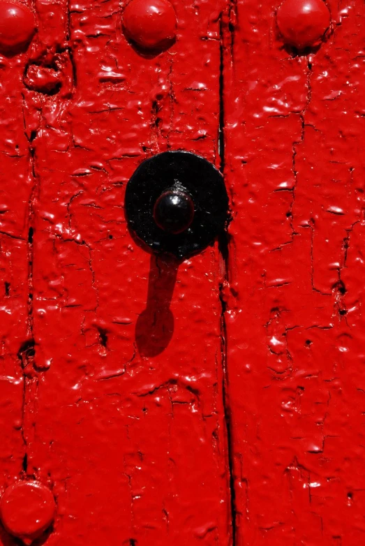 the door  is black and red with small drops