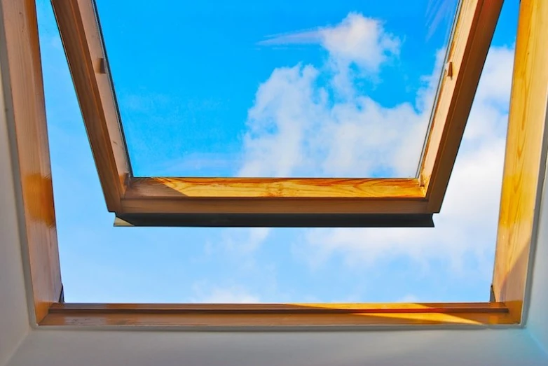 a skylight is opened to expose the clouds