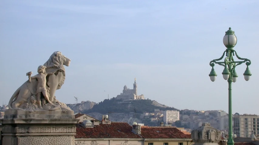 an ornate statue on top of a building