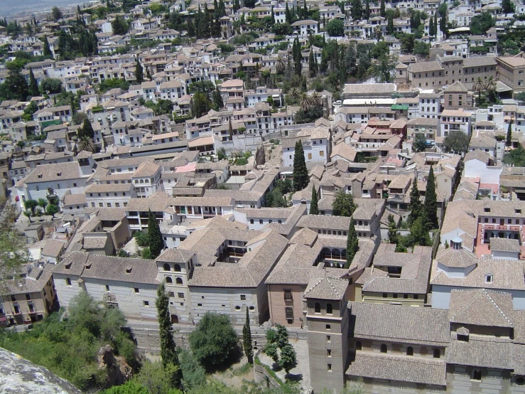 an aerial view of a city with several old buildings
