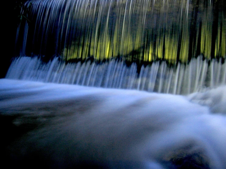 a stream with lots of water cascading over it