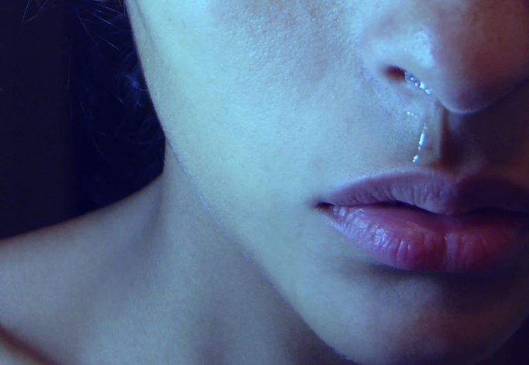 woman with nose ring getting water dripping from it