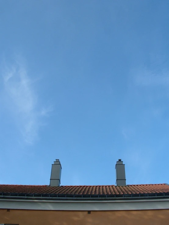 the top of the building has two clocks on it