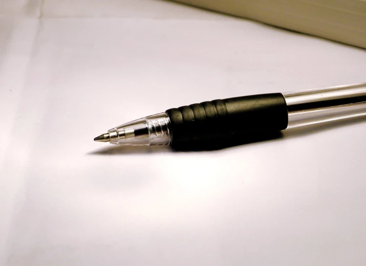 an artistically shaped fountain pen on a white table