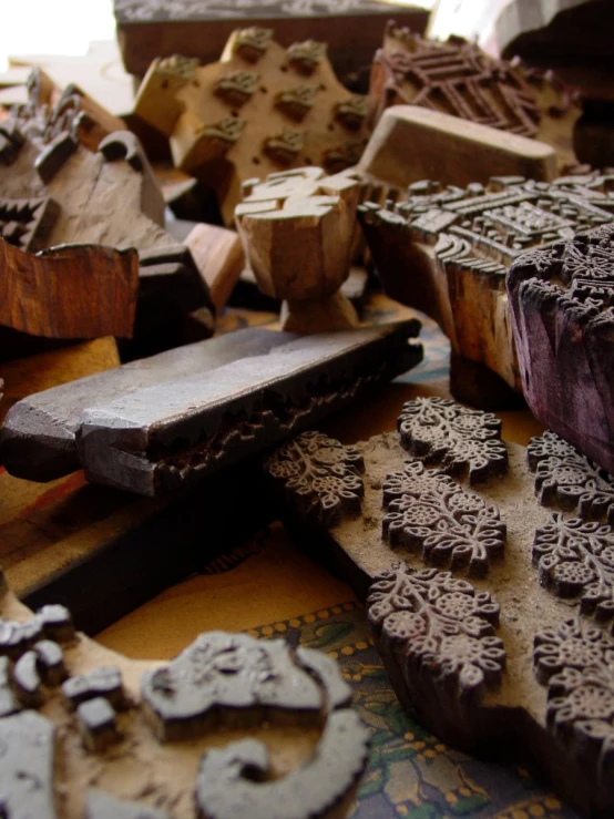 a close up of some wooden object near many different types of tools