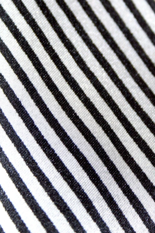 the bottom of a black and white striped jacket