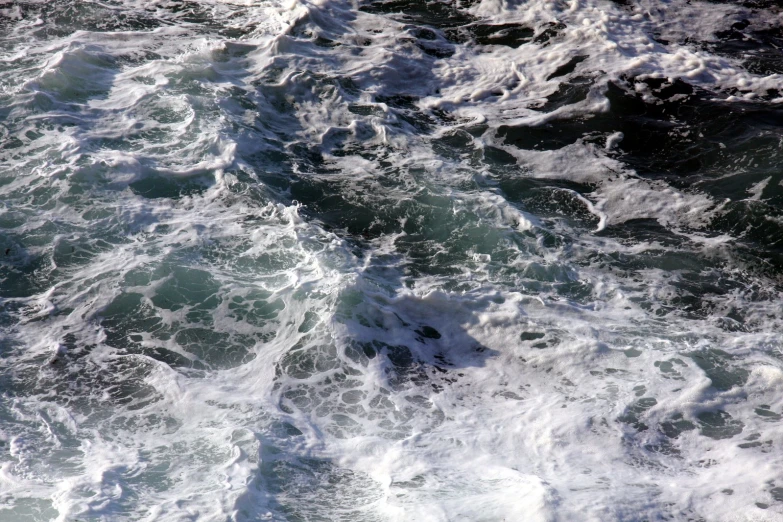 a view of waves from a ship in the water