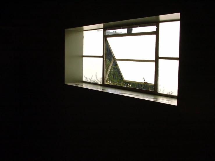 a window view out onto a small green field