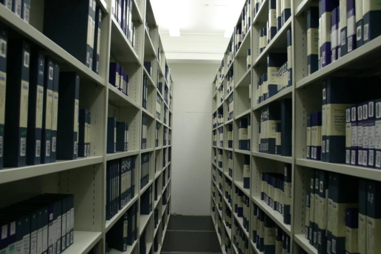 some shelves filled with lots of books near one another