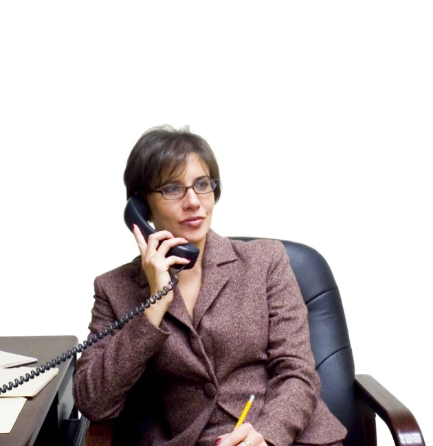 an image of woman in suit talking on the phone