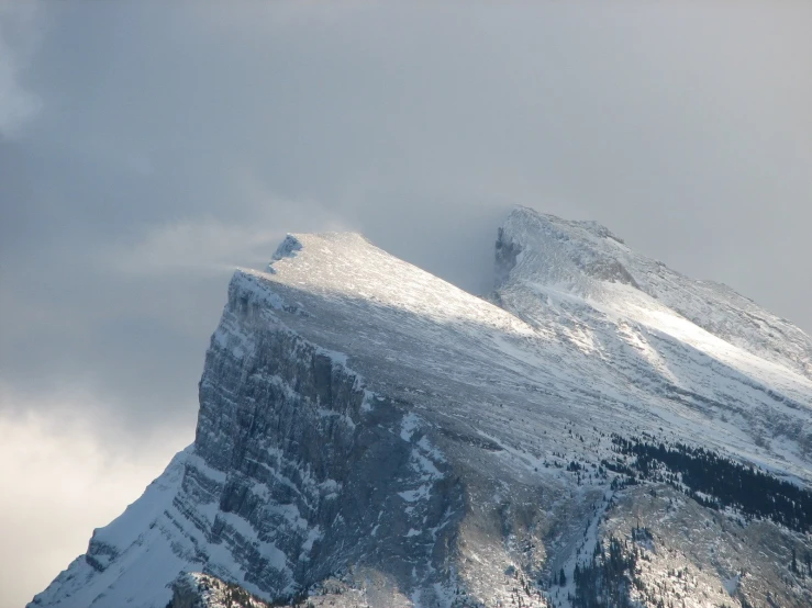 a mountain is shown with snow on it