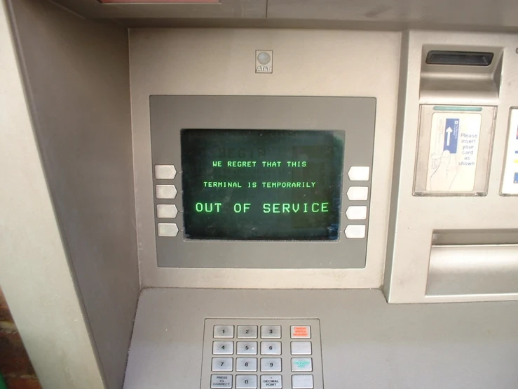 there is a green sign on the atm machine