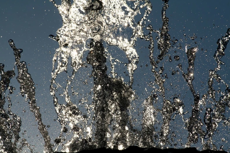 several water gushing out of a  air balloon