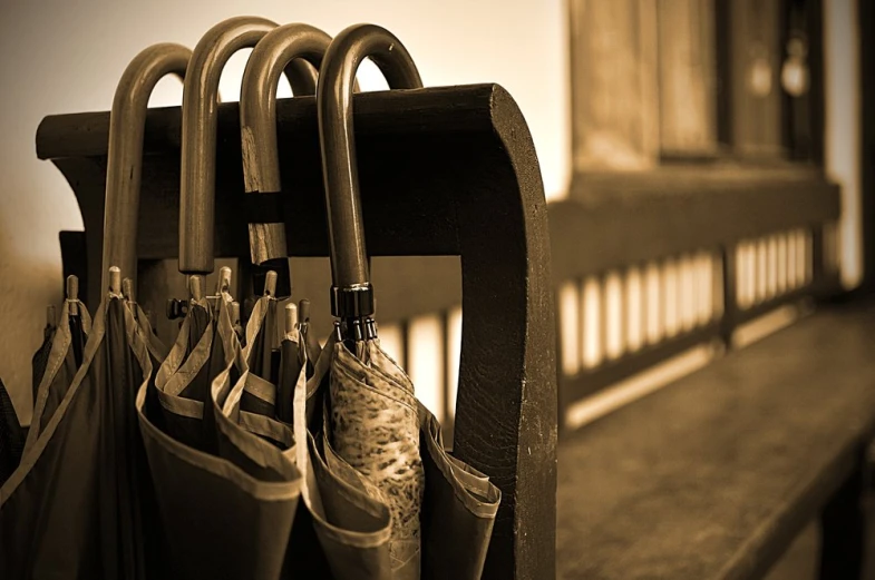 a couple of umbrellas that are sitting in a holder