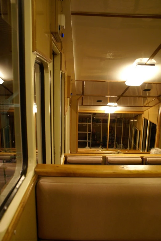 a long train with three windows and two bench seats