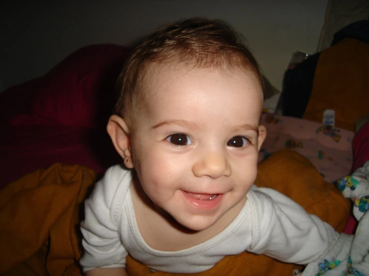an image of a baby smiling at the camera