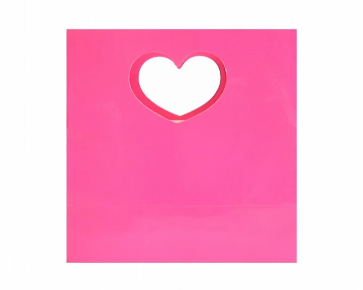 a pink paper bag with a cutout heart