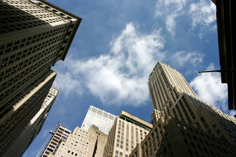 looking up at a group of tall buildings