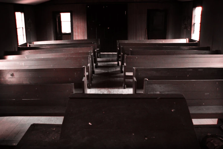 black and white pograph of benches and tables in a church