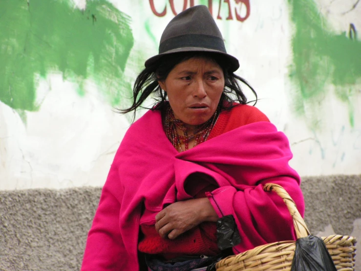 a woman is walking and looking back in thought