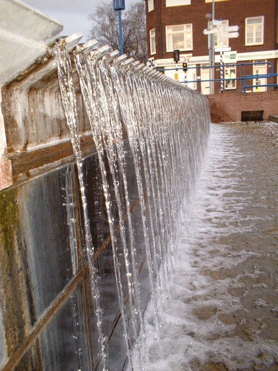 a wall with water spewing down it