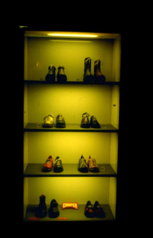 a group of shoes that are in some shelves